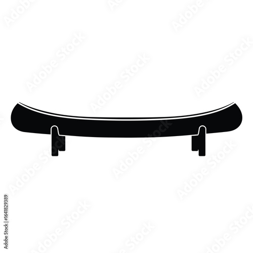Black canoe resting on supports boat watercraft