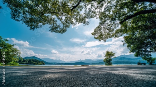 Scenic Lake View Framed by Lush Green Trees on a Sunny Day, Peaceful Serene Landscape