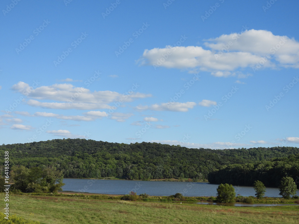 Obraz premium The picturesque scenery of the wilderness that surrounds the lake, nestled within the Middle Creek Wildlife Management Area, Lancaster County, Pennsylvania.