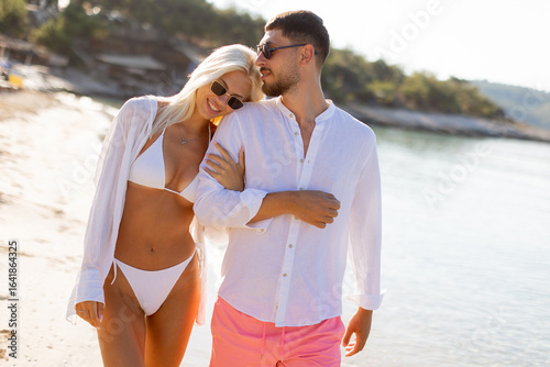 Couple enjoying a sunny bea...