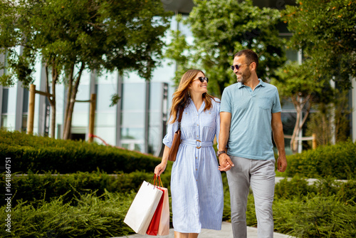 Couple strolls hand in hand...