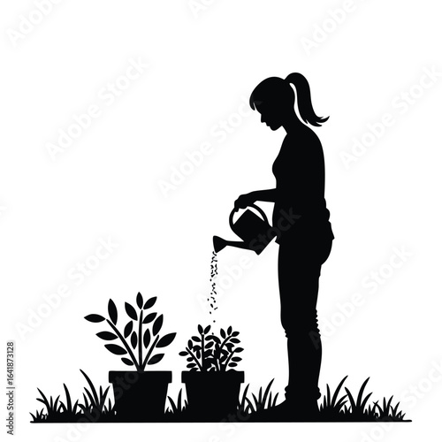 Silhouette of woman watering potted plants in garden