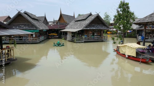Floating market in damnoen saduak is a popular tourist attraction in thailand