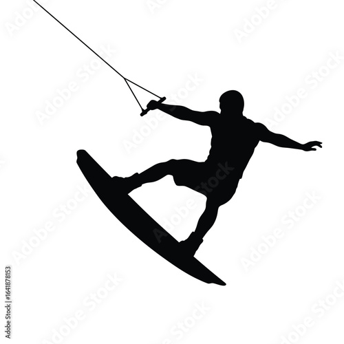 Silhouette wakeboarder performing aerial trick water