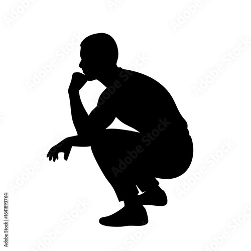 Silhouette of a man squatting and looking toward the left side