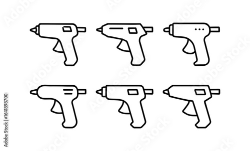 Set of linear glue guns on white background