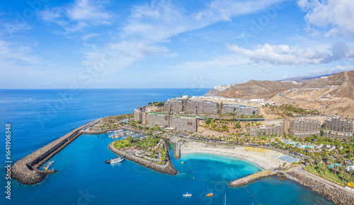 Billede på lærred Aerial view of Anfi Beach, Gran Canaria, with turquoise waters, luxury resorts, and a picturesque marina