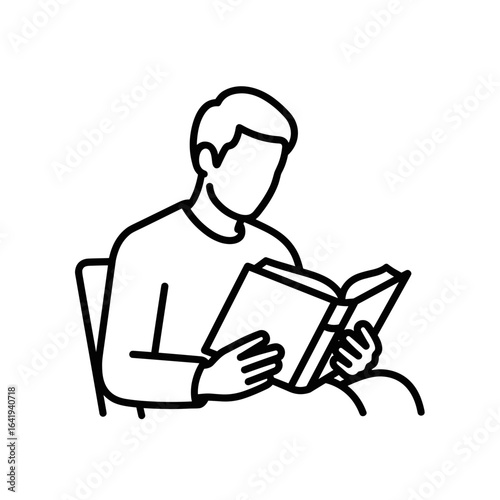 Young man reading a book while sitting in a chair indoors  icon