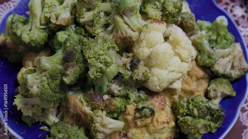 Broccoli and cauliflower are marinated and steamed