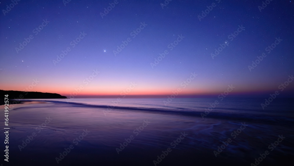 Fototapeta premium Starry night sky over the ocean at sunset with a beautiful horizon view