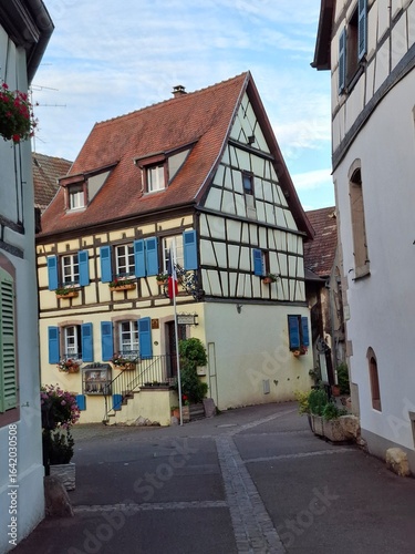 narrow street in the old town of Riquewihr, Alsace, France