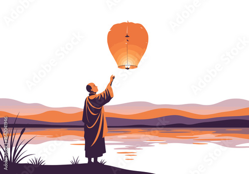 Monk releasing a glowing orange sky lantern at sunset.