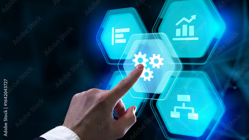 Businessman touching a virtual screen with holographic business icons and gears in a bright studio. Businessman touching a virtual screen with holographic business icons and gears in a bright studio.