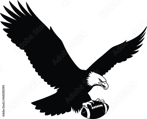 Majestic bald eagle carrying american football in its talons silhouette