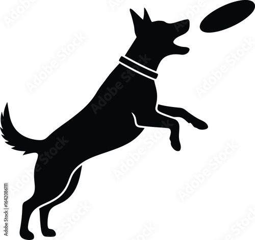 Energetic dog jumping to catch a frisbee silhouette