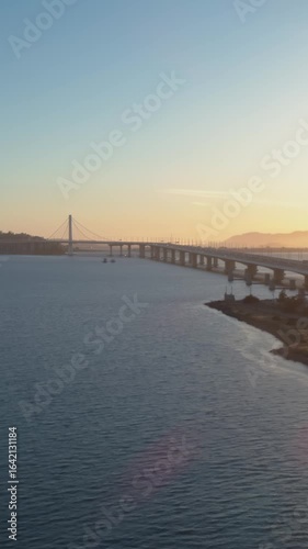 Wallpaper Mural Aerial view of the Bay Bridge, Oakland, California, USA, at sunrise. Cars travel across the bridge, connecting San Francisco to the East Bay. Torontodigital.ca