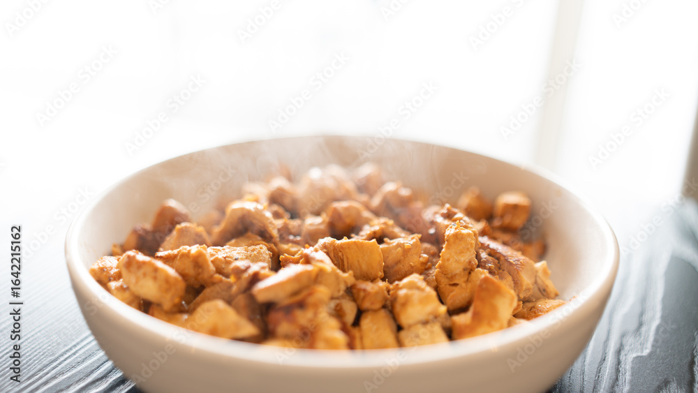 Juicy cubed chicken sautéed with garlic and minimal oil, steaming fresh. Healthy protein dish perfect for meal prep, fitness recipes, and food photography Juicy cubed chicken sautéed with garlic and minimal oil, steaming fresh. Healthy protein dish perfect for meal prep, fitness recipes, and food photography