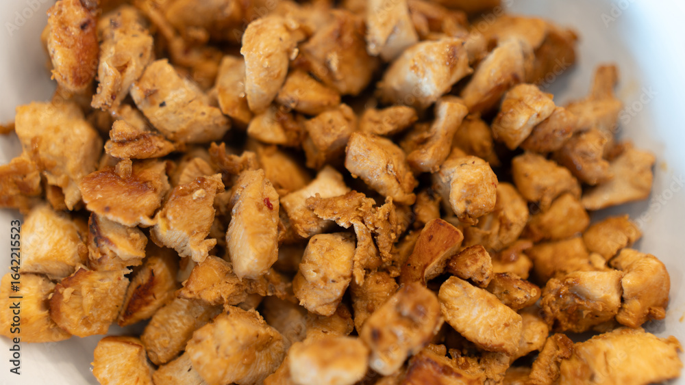 Juicy cubed chicken sautéed with garlic and minimal oil, steaming fresh. Healthy protein dish perfect for meal prep, fitness recipes, and food photography Juicy cubed chicken sautéed with garlic and minimal oil, steaming fresh. Healthy protein dish perfect for meal prep, fitness recipes, and food photography