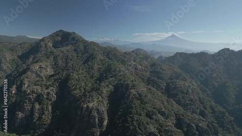 Aerial view of the Popocatépetl volcano in Mexico, seen from beautiful meadows. Mountains and volcanoes of Mexico, travel and vacation concept, 4k nature.
