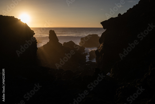 The ocean at sunset, in a saltiness mist