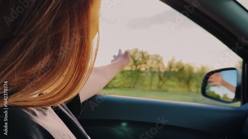 Wallpaper Mural girl woman stuck her hand window, wind hair girl woman enjoying air nature, sunlight through fingers, automobile travel happy face girl person, active lifestyle vacation travel weekend vacation family Torontodigital.ca