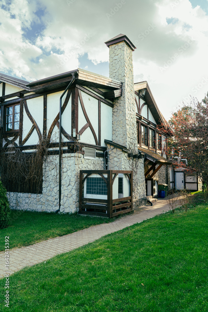 Stone house with air conditioning unit in wooden frame outside Stone house with air conditioning unit in wooden frame outside