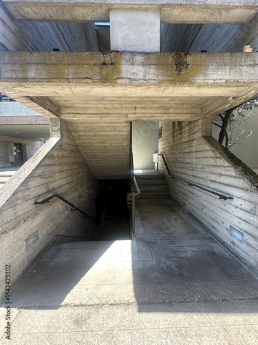 Symmetrical Brutalist Stairway with Light and Shadow