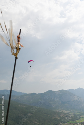 Man paragliding in the town of Organya in the province of Lleida in northern Spain in August 2025.