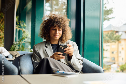 Businesswoman communicate via her phone