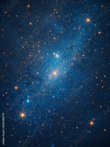 Dreamy indigo night sky filled with twinkling golden stars and celestial dust