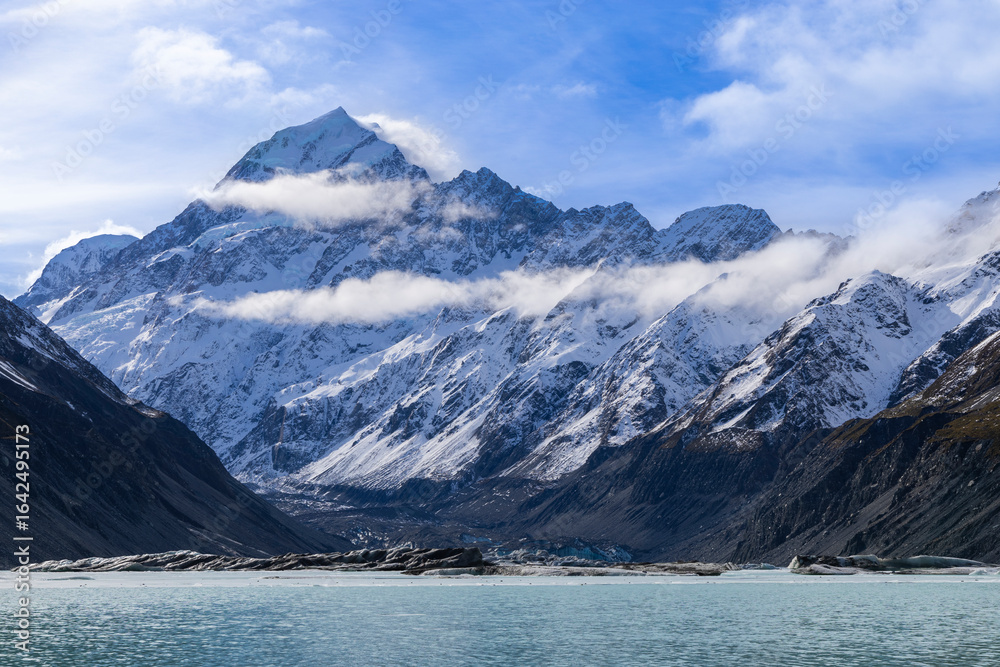 Mount Cook Framed by Clouds Above Hooker Lake in New Zealand Mount Cook Framed by Clouds Above Hooker Lake in New Zealand