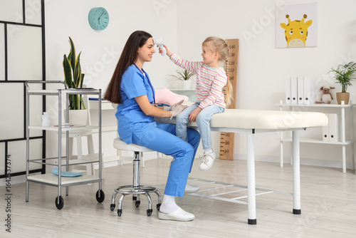 Female pediatrician and lit...