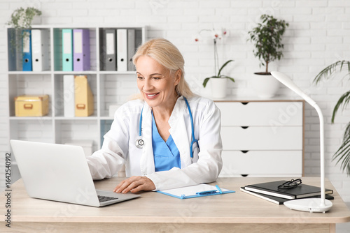 Female doctor working with ...