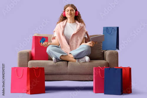 Young happy woman in headph...