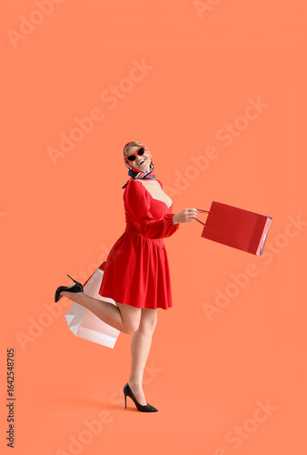 Happy woman in red dress an...