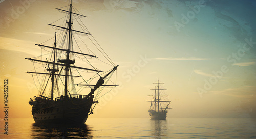 Silhouetted Sailing Ships on Misty Ocean at Sunset Horizon
