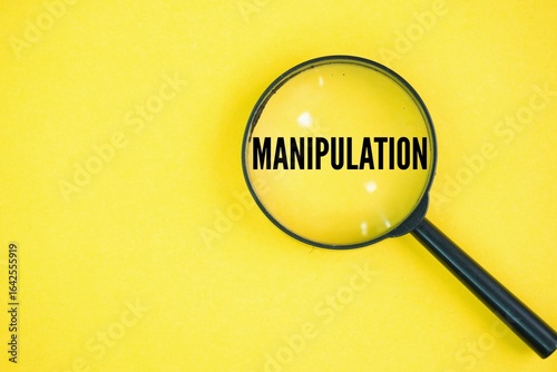 Magnifying glass with the word manipulation. the act of influencing or controlling someone, often in a subtle or underhanded way, to achieve a desired outcome.