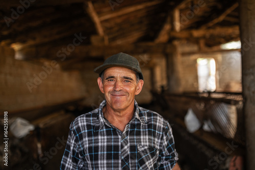 Portrait of rancher in goat stable