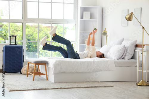 Relaxed young woman lying o...