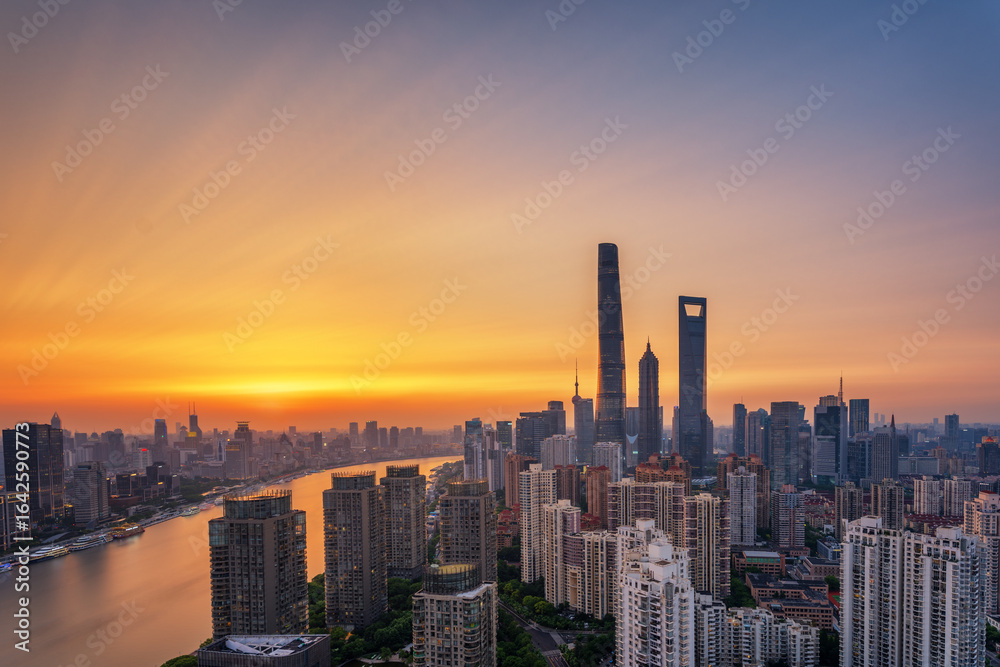 Fototapeta premium Overlooking Shanghai Lujiazui skyscrapers at golden dusk