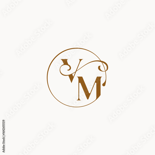 luxurius feeling with flow VM monogram elegant style letter circle fows wedding logo