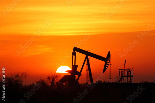 Sunset oil industry at the field in Thailand