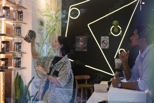 Customer browse cannabis products in a modern dispensary setting.
