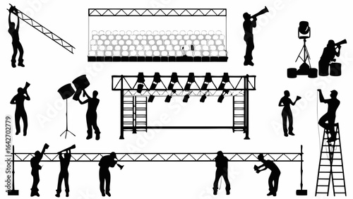 Silhouetted stagehands preparing a stage with lighting rigs and seating for a performance event