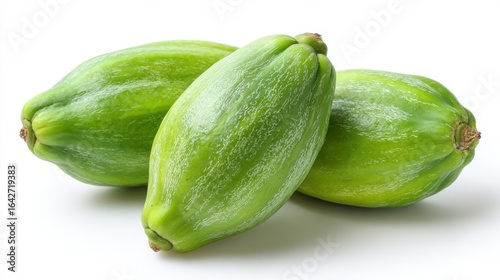 Wallpaper Mural Three green papayas are positioned closely together, showcasing their smooth skin and elongated forms against a plain white backdrop. The fruit appears fresh and ready for culinary use. Torontodigital.ca