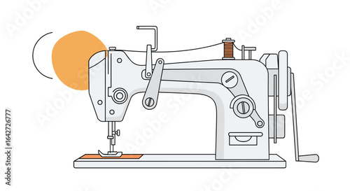 Vintage industrial sewing machine with metal parts and orange circle accent