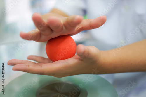 Close-Up of Hand Therapy Using Red Stress Ball