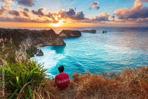 Sunrise view of scenic cliff islands and Diamond Beach at Nusa Penida, Indonesia. Crystal-clear turquoise water of the ocean. Wonderful sea view. Diamond Beach is a popular tourist attraction of Asia.