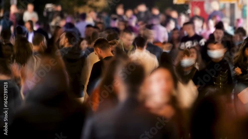 Timelapse Crowd of People Walking a Busy Street at Night. People in Motion Blur and Vibrant Town Atmosphere. Representing Urban Life and Activity Video Showing a Large Group Persons Along Outdoor 4k