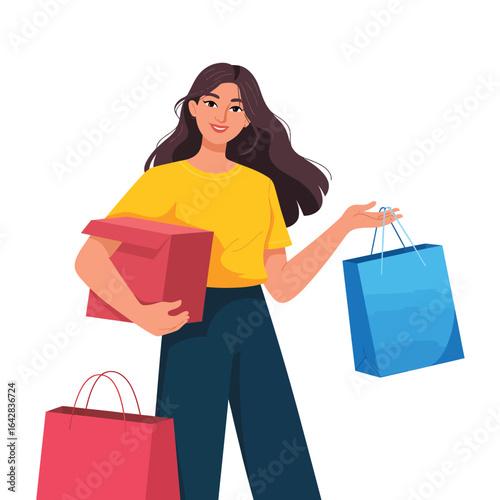Happy woman holding shopping bags and a gift box